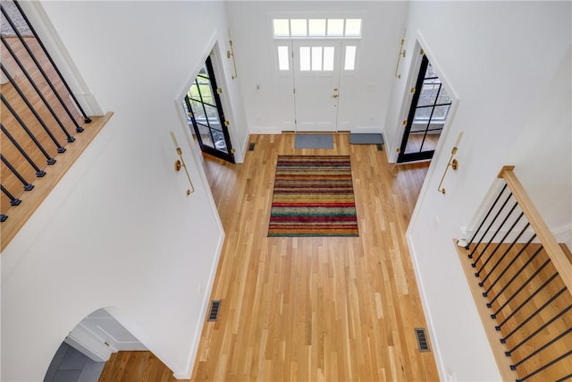 313 Wexford Ln, Horseheads, NY 14845 - foyer featuring light wood-type flooring, stairway, and baseboards