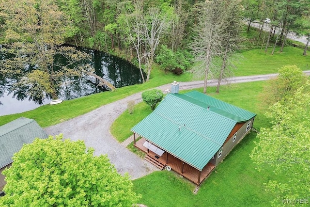 aerial view of property and surrounding area with a nearby body of water