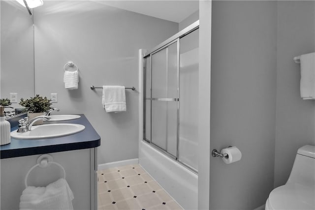 670 Raymond Dr, Lewiston, NY 14092 - full bathroom with toilet, shower / bath combination with glass door, and double vanity