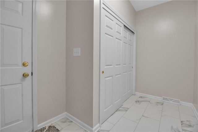 670 Raymond Dr, Lewiston, NY 14092 - entryway featuring light marble finish floors and baseboards