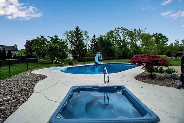 670 Raymond Dr, Lewiston, NY 14092 - view of swimming pool with a water slide, an in-ground hot tub, and view of wooded area