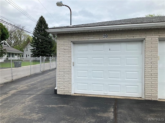 5854 Main St Unit 407, Amherst, NY 14221 - garage featuring fence