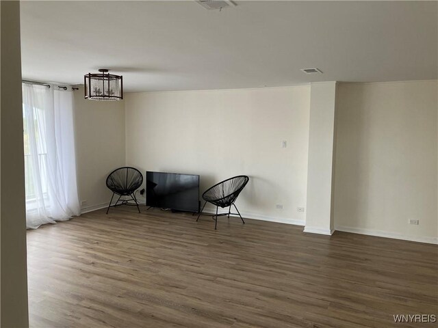 5854 Main St Unit 407, Amherst, NY 14221 - unfurnished room with wood finished floors and baseboards