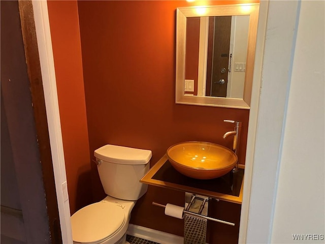 5854 Main St Unit 407, Amherst, NY 14221 - half bathroom with a sink, toilet, and baseboards