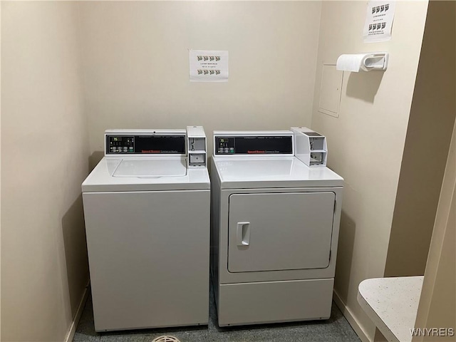 5854 Main St Unit 407, Amherst, NY 14221 - communal laundry room featuring washing machine and clothes dryer and baseboards