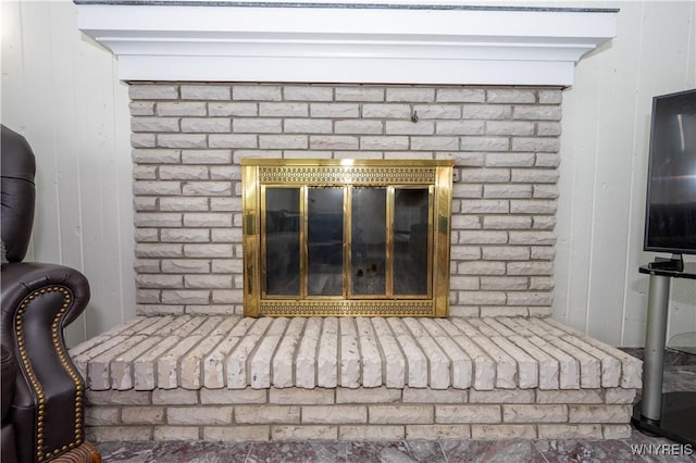 detailed view of a brick fireplace and wood walls