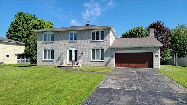 view of front of home featuring a chimney, a garage, brick siding, and driveway