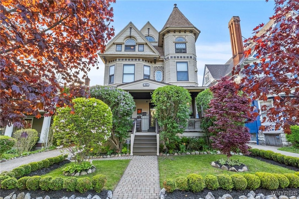 48 Crescent Ave, Buffalo, NY 14214 - victorian house with a porch and a front yard