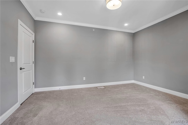 empty room with ornamental molding, carpet floors, a smoke detector, recessed lighting, and baseboards