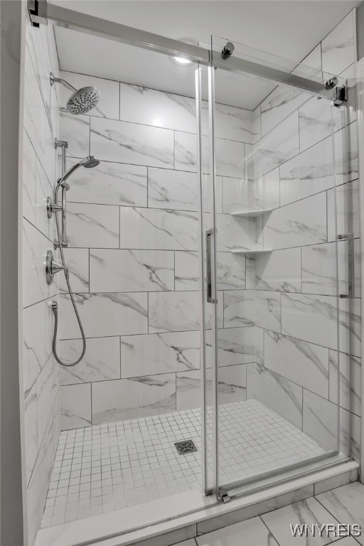 full bath featuring a stall shower