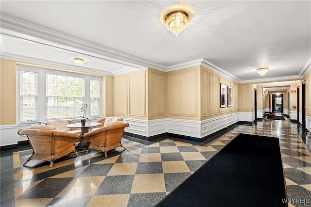 community lobby with a decorative wall and crown molding
