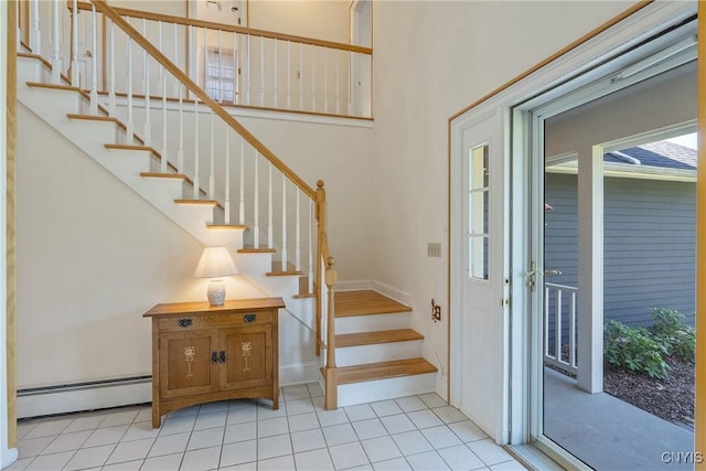 4268 Colorado Run, Onondaga, NY 13215 - staircase featuring a baseboard heating unit, tile patterned floors, and baseboards