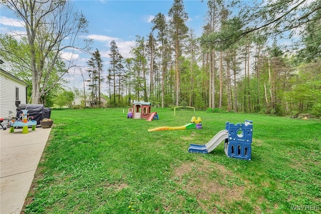 11965 Clinton St, Marilla, NY 14004 - view of green lawn featuring a playground
