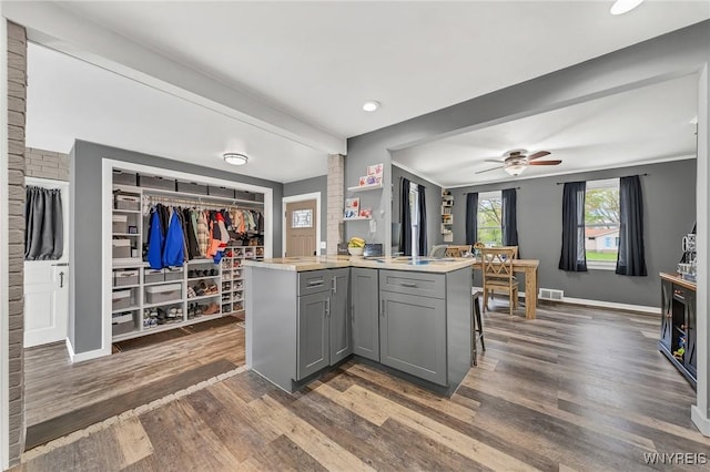 11965 Clinton St, Marilla, NY 14004 - kitchen with gray cabinetry, dark wood-type flooring, light countertops, baseboards, and a ceiling fan