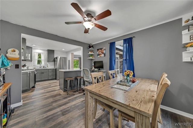 11965 Clinton St, Marilla, NY 14004 - dining space featuring ceiling fan, wood finished floors, and baseboards