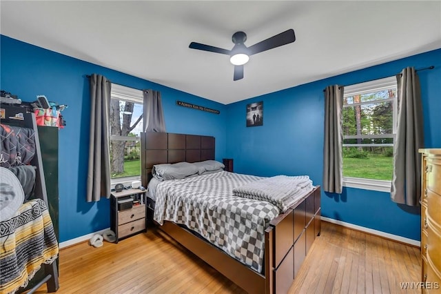 11965 Clinton St, Marilla, NY 14004 - bedroom featuring light wood-style flooring, multiple windows, and baseboards