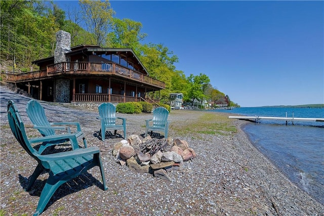 7577 E Bluff Dr, Jerusalem, NY 14527 - view of yard featuring an outdoor fire pit and a deck with water view