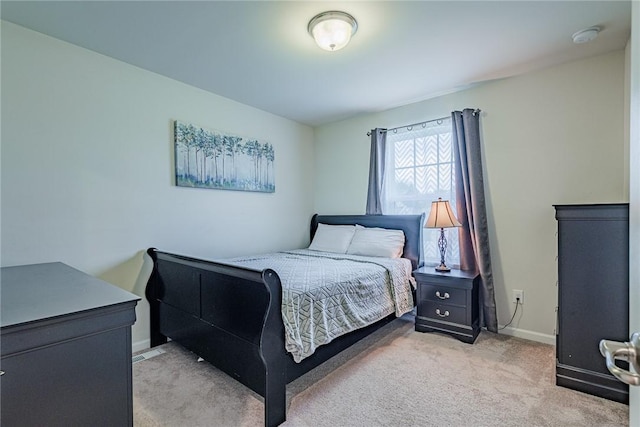 carpeted bedroom with baseboards