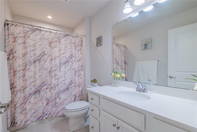 bathroom featuring tile patterned floors, toilet, vanity, and curtained shower