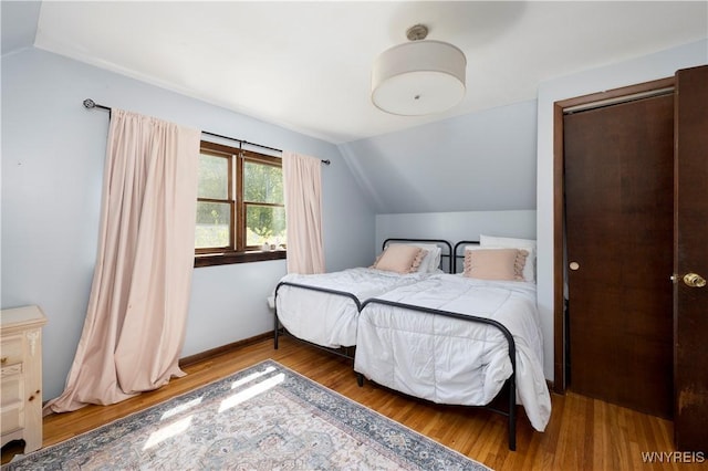 30 Schultz Rd, Orchard Park, NY 14127 - bedroom with wood finished floors, lofted ceiling, and baseboards