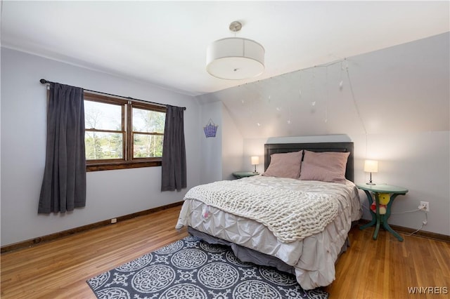 30 Schultz Rd, Orchard Park, NY 14127 - bedroom with light wood-type flooring, baseboards, and lofted ceiling