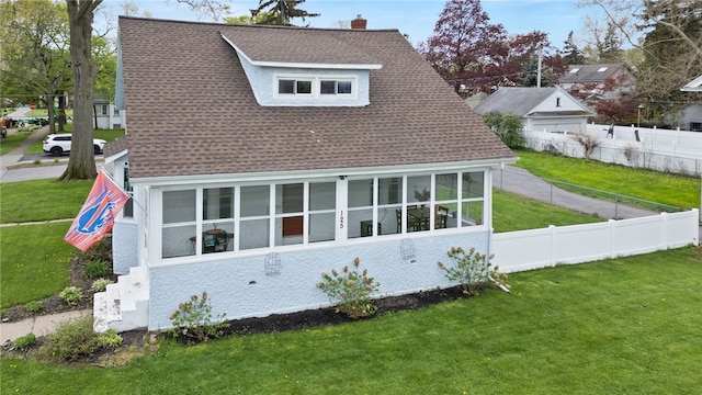 view of property exterior featuring roof with shingles and a chimney