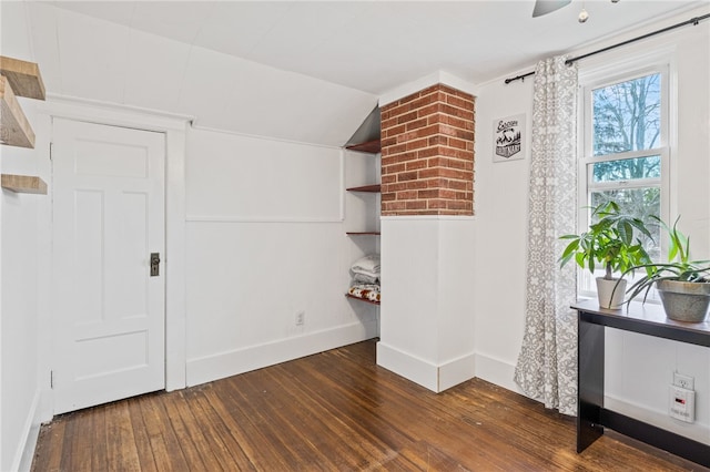 bonus room featuring hardwood / wood-style floors, baseboards, and lofted ceiling