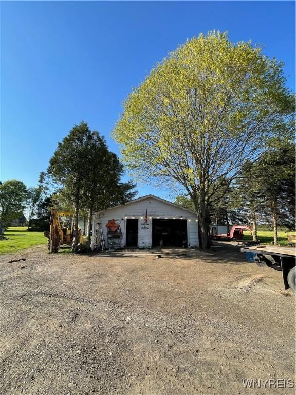 12866 Genesee Rd, Sardinia, NY 14030 - view of front of house with a detached garage and an outdoor structure