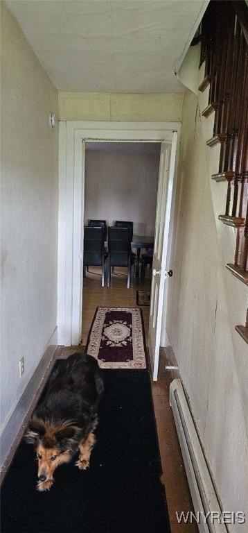 12866 Genesee Rd, Sardinia, NY 14030 - corridor featuring a baseboard radiator and wood finished floors