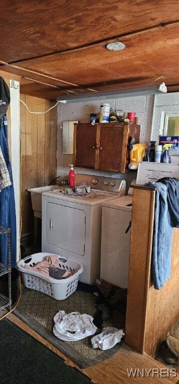 12866 Genesee Rd, Sardinia, NY 14030 - laundry area featuring cabinet space, wood ceiling, washer and clothes dryer, and wood walls