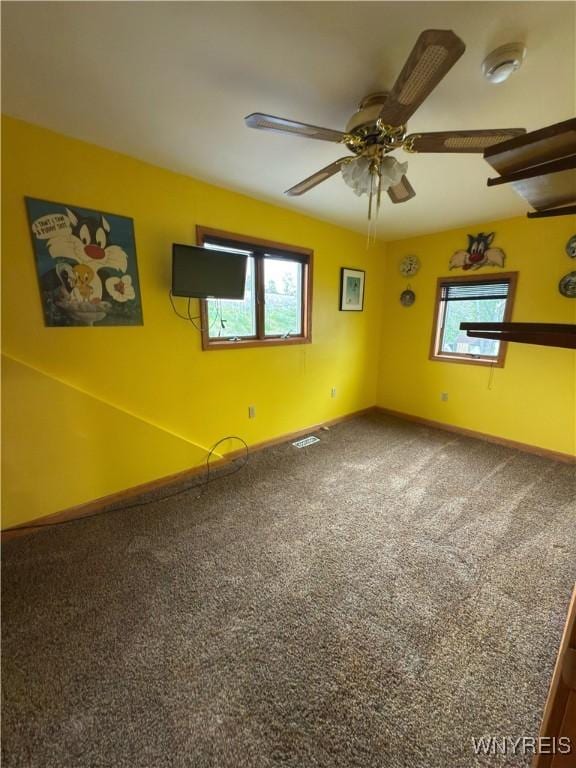 116 Fuller Ave, Tonawanda-City, NY 14150 - unfurnished room with plenty of natural light, carpet floors, a ceiling fan, and baseboards