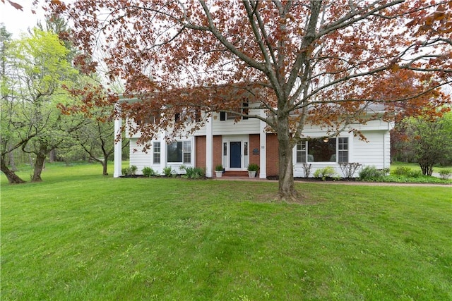 52 High St, Alfred, NY 14802 - view of front of home featuring a front lawn and brick siding