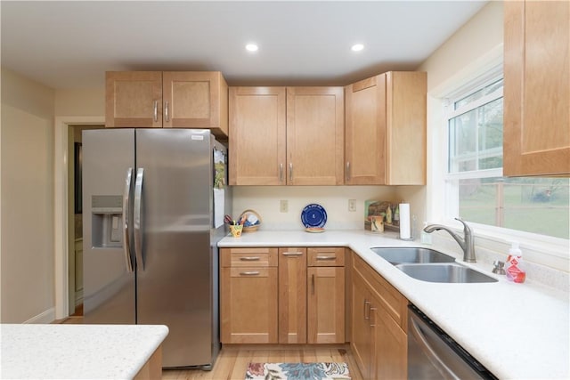 52 High St, Alfred, NY 14802 - kitchen featuring stainless steel appliances, a sink, light countertops, recessed lighting, and light wood-style flooring