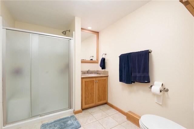52 High St, Alfred, NY 14802 - bathroom featuring a stall shower, toilet, vanity, and tile patterned floors