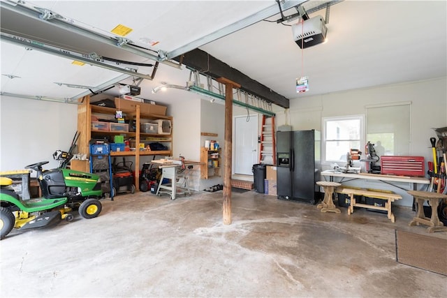 52 High St, Alfred, NY 14802 - garage with black fridge, a garage door opener, and a workshop area