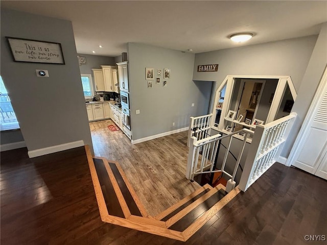 1404 Riverbend Dr, Lysander, NY 13027 - hall with an upstairs landing, wood finished floors, baseboards, and recessed lighting