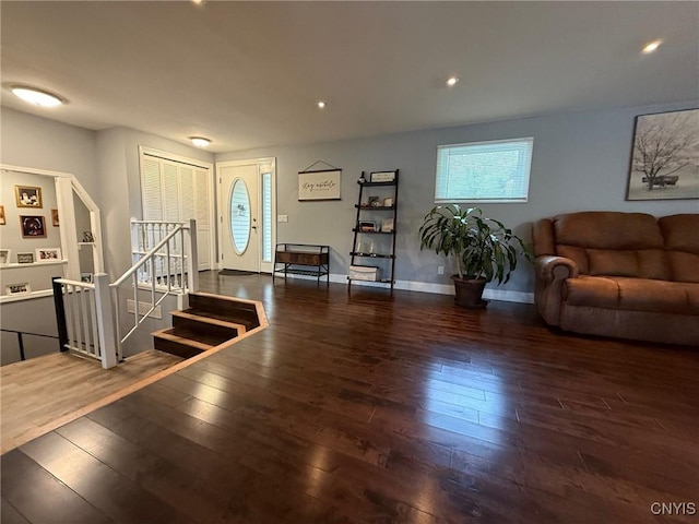 1404 Riverbend Dr, Lysander, NY 13027 - living area with hardwood / wood-style flooring, baseboards, and stairs