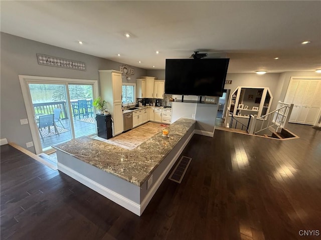 1404 Riverbend Dr, Lysander, NY 13027 - kitchen featuring a sink, stainless steel dishwasher, baseboards, dark wood finished floors, and recessed lighting
