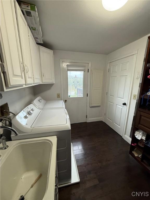 1404 Riverbend Dr, Lysander, NY 13027 - laundry area featuring separate washer and dryer, cabinet space, and dark wood-style flooring