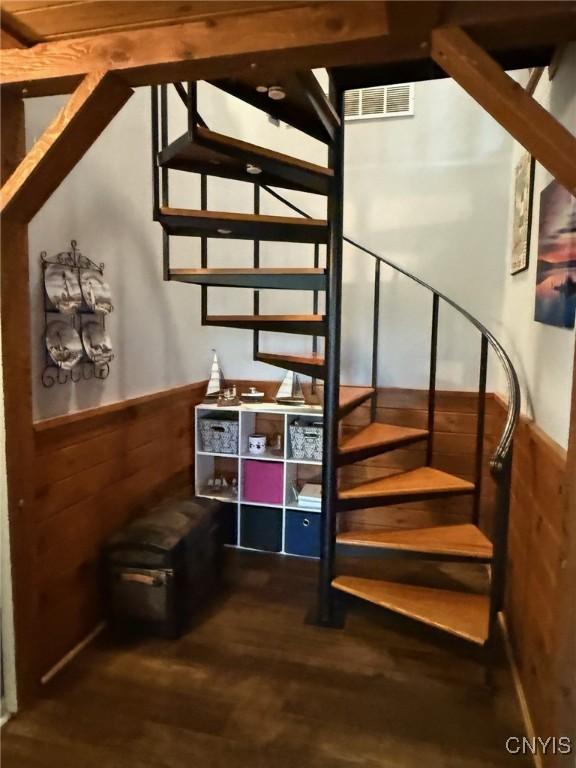 1404 Riverbend Dr, Lysander, NY 13027 - stairs with wainscoting, wood finished floors, and wooden walls