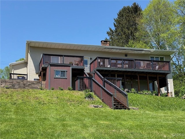 1404 Riverbend Dr, Lysander, NY 13027 - back of property featuring stairs, a wooden deck, a yard, and a chimney