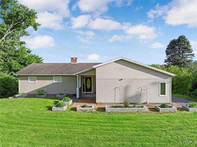 1404 Riverbend Dr, Lysander, NY 13027 - back of house with a yard and a chimney