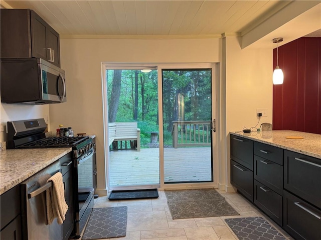 kitchen featuring stainless steel appliances, ornamental molding, light stone countertops, hanging light fixtures, and light tile patterned flooring
