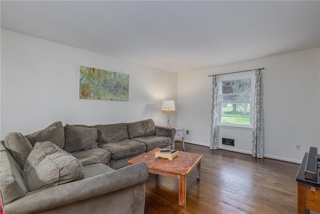 living room featuring dark wood-style floors and baseboards