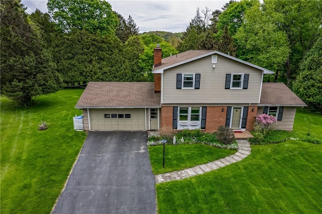 view of front of home with asphalt driveway, an attached garage, a front lawn, and a chimney