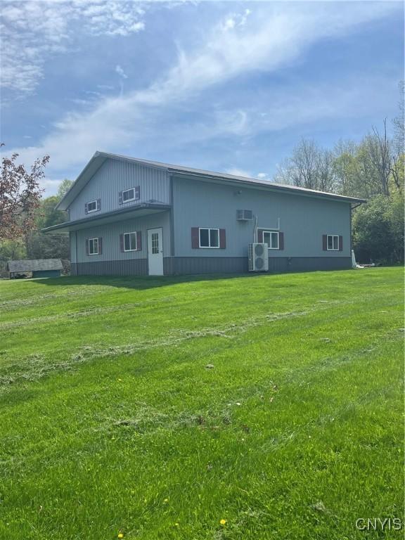 8054 Fargo Rd, Henderson, NY 13650 - back of house featuring a lawn