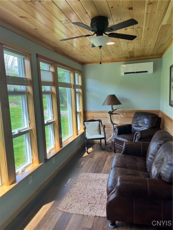 8054 Fargo Rd, Henderson, NY 13650 - sunroom / solarium with wood ceiling, a wall mounted AC, wainscoting, crown molding, and hardwood / wood-style floors
