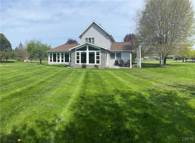8054 Fargo Rd, Henderson, NY 13650 - rear view of property with stone siding and a lawn