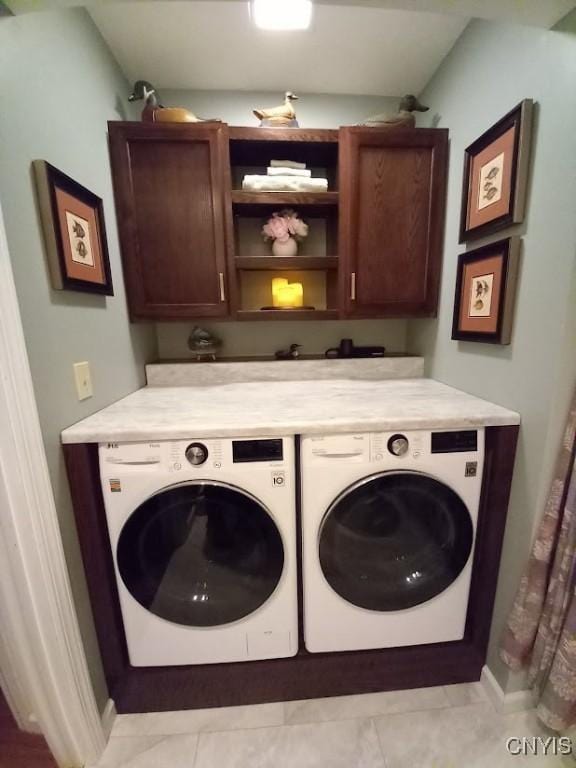 8054 Fargo Rd, Henderson, NY 13650 - laundry area featuring cabinet space, washer and dryer, baseboards, and light tile patterned floors