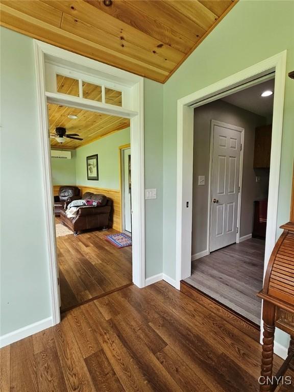 8054 Fargo Rd, Henderson, NY 13650 - corridor featuring wood finished floors, vaulted ceiling, wooden ceiling, and baseboards